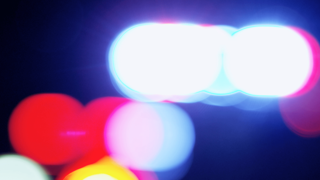 Bokeh Police Lights on a Cruiser 4k Royalty Free Stock Video