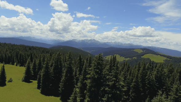 Flying Over A Field and Into The Mountains 4k